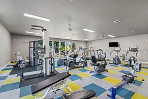 Springfield apartment for rent - A gym with a variety of equipment including treadmills, weights, and exercise machines.