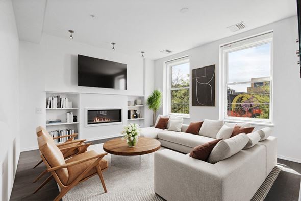 Washington apartment for rent - a living room with a couch and a table and a television