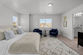 Santa Clara apartment for rent - a bedroom with a large bed and two chairs