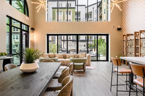 Irvine apartment for rent - A modern dining area with a long table and chairs.