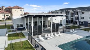 Richland apartment for rent - A modern building with a pool in front.