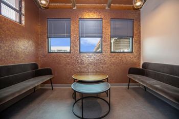 Community bar with kitchenette, bar seating and personal booth
