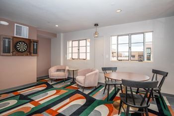 Community bar with kitchenette, bar seating and personal booth