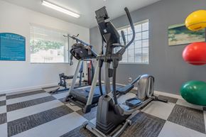 Sierra Vista apartment for rent - A gym with a treadmill, exercise ball, and other equipment.