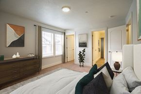 Layton apartment for rent - a bedroom with a large bed and a dresser