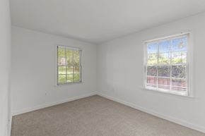 Arlington apartment for rent - A room with two windows and carpeted floor.