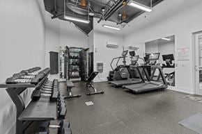 Seattle apartment for rent - A gym with treadmills, exercise bikes, and other equipment.