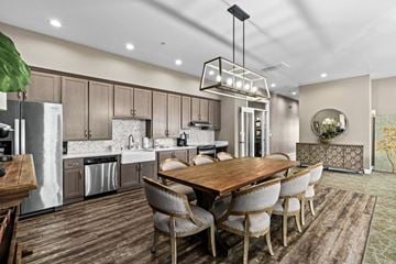 Salem apartment for rent - A modern kitchen with a wooden table and chairs.
