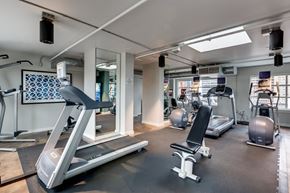 Seattle apartment for rent - A gym with treadmills, exercise balls, and other equipment.