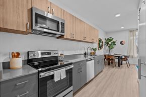 Caldwell apartment for rent - a kitchen with stainless steel appliances and wooden cabinets