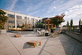 Portland apartment for rent - A sunny day at the outdoor seating area of a modern building.