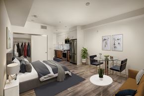 Los Angeles apartment for rent - A modern bedroom with a large bed and a dining area.