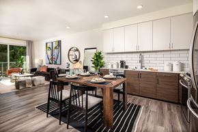 Los Angeles apartment for rent - A modern kitchen with a dining table set for two.