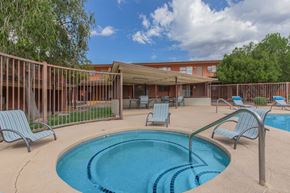 Tucson apartment for rent - A small pool with a metal fence around it.