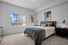 Pasco apartment for rent - a bedroom with a bed and a large window