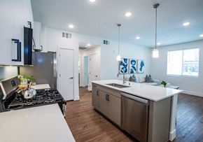 North Las Vegas apartment for rent - A modern kitchen with a stove top oven and a refrigerator.
