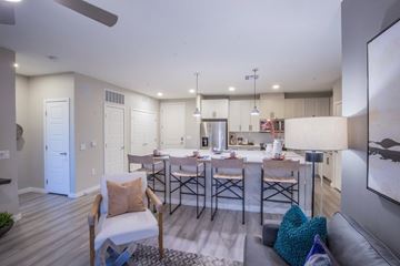Las Vegas apartment for rent - A modern kitchen with a dining table and chairs.