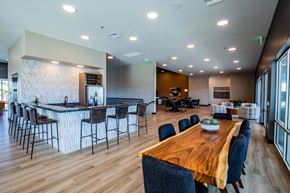 North Las Vegas apartment for rent - A modern dining room with a wooden table and chairs.