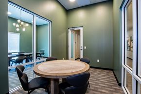 Henderson apartment for rent - A conference room with a round table and chairs.