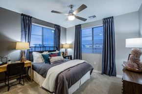 Las Vegas apartment for rent - A bedroom with a bed, desk, and chair.