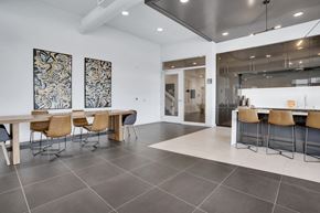Portland apartment for rent - A modern dining room with a long table and chairs.