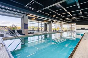 Portland apartment for rent - A large indoor swimming pool with a glass ceiling and a view of the outdoors.