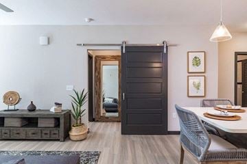 Tampa apartment for rent - a dining room with a table and a door to a living room