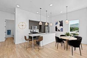 Salt Lake City apartment for rent - A modern kitchen with a dining table and chairs.