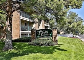 Holladay apartment for rent - an apartment building with a sign in the grass