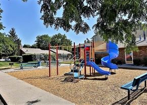 Holladay apartment for rent - a playground with a blue slide in a park