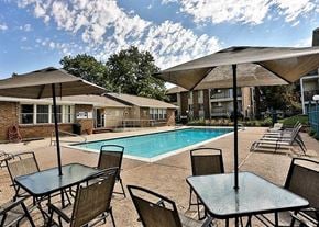 Holladay apartment for rent - a swimming pool and tables with umbrellas