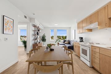 Seattle apartment for rent - A modern kitchen with a dining table and chairs.