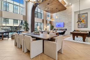 Austin apartment for rent - A modern dining room with a long table and chairs.