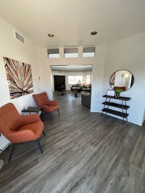 Tucson apartment for rent - A living room with a grey floor and white walls.