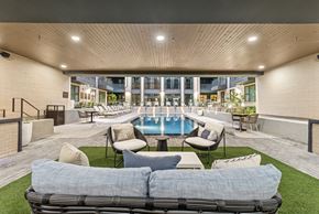 Austin apartment for rent - A patio with a pool and lounge chairs.