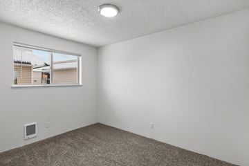 Walla Walla apartment for rent - the living room of an apartment with a window and carpet