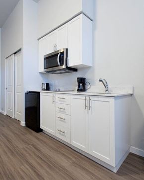 Walla Walla apartment for rent - a kitchen with a microwave and white cabinets
