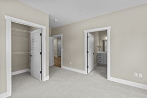 Richland apartment for rent - a bedroom with two closets and a bathroom in the background