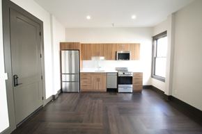 Tucson apartment for rent - A kitchen with wooden cabinets and stainless steel appliances.