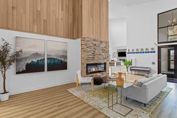 Richland apartment for rent - A living room with a fireplace and a painting on the wall.