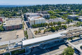 Seattle apartment for rent - A cityscape with a large white building in the center.