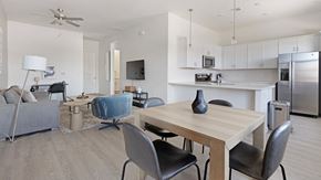 Oro Valley apartment for rent - A modern dining room with a wooden table and chairs.