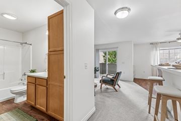 Walla Walla apartment for rent - A bathroom with a wooden cabinet and a chair in the living room.