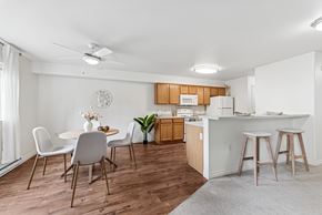 Walla Walla apartment for rent - A kitchen with a dining table and chairs.at Lion's Gate, Washington