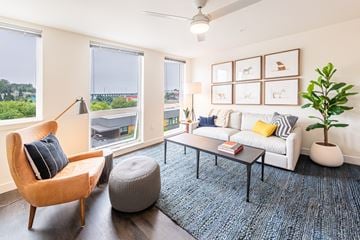 Seattle apartment for rent - a living room with a white couch and a coffee table