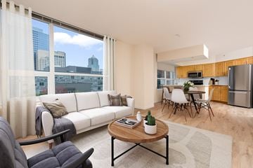 Seattle apartment for rent - A modern living room with a white sofa and a coffee table.