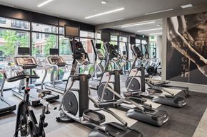 Denver apartment for rent - A gym with treadmills, elliptical machines, and other exercise equipment.