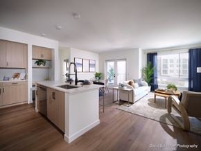 Chula Vista apartment for rent - A modern kitchen with wooden cabinets and a white island.
