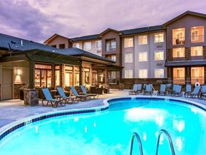 Great Falls apartment for rent - a swimming pool with chairs in front of a hotel
