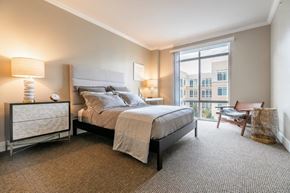 Mercer Island apartment for rent - The Mercer Master Bedroom with bed, chair, and window